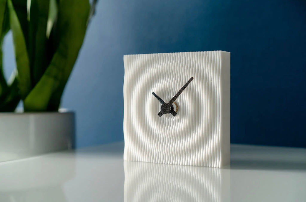 Pixo Ripple desk clock side view with soft-edged square silhouette